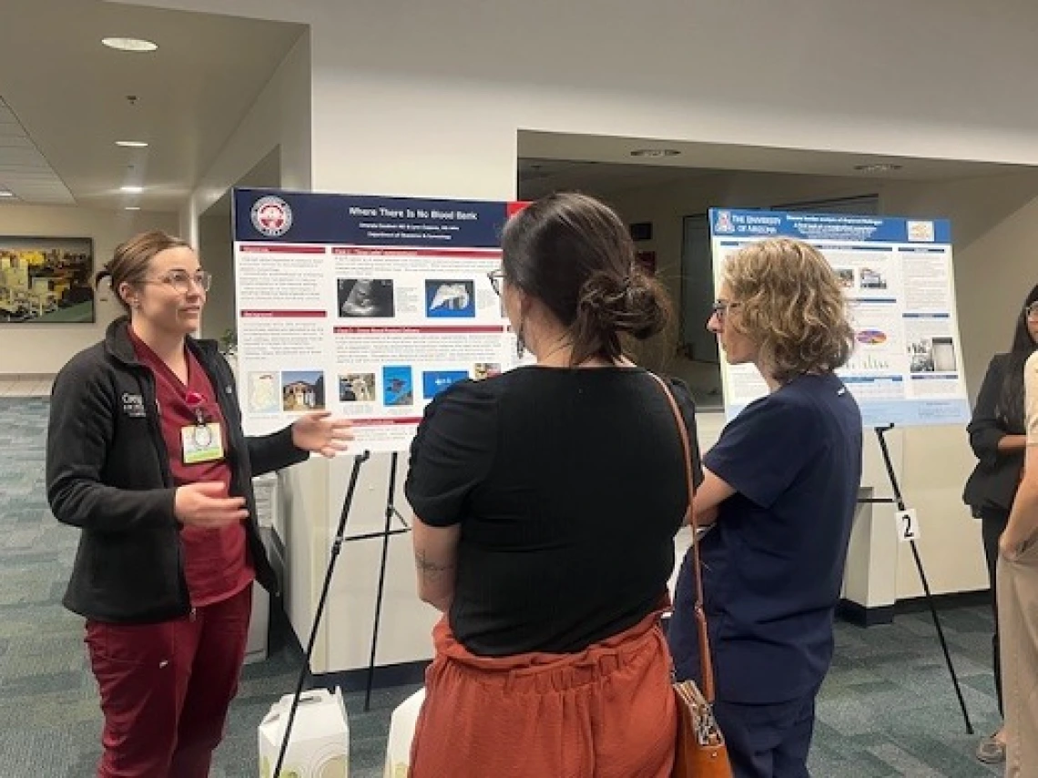 Doctor explaining her project poster