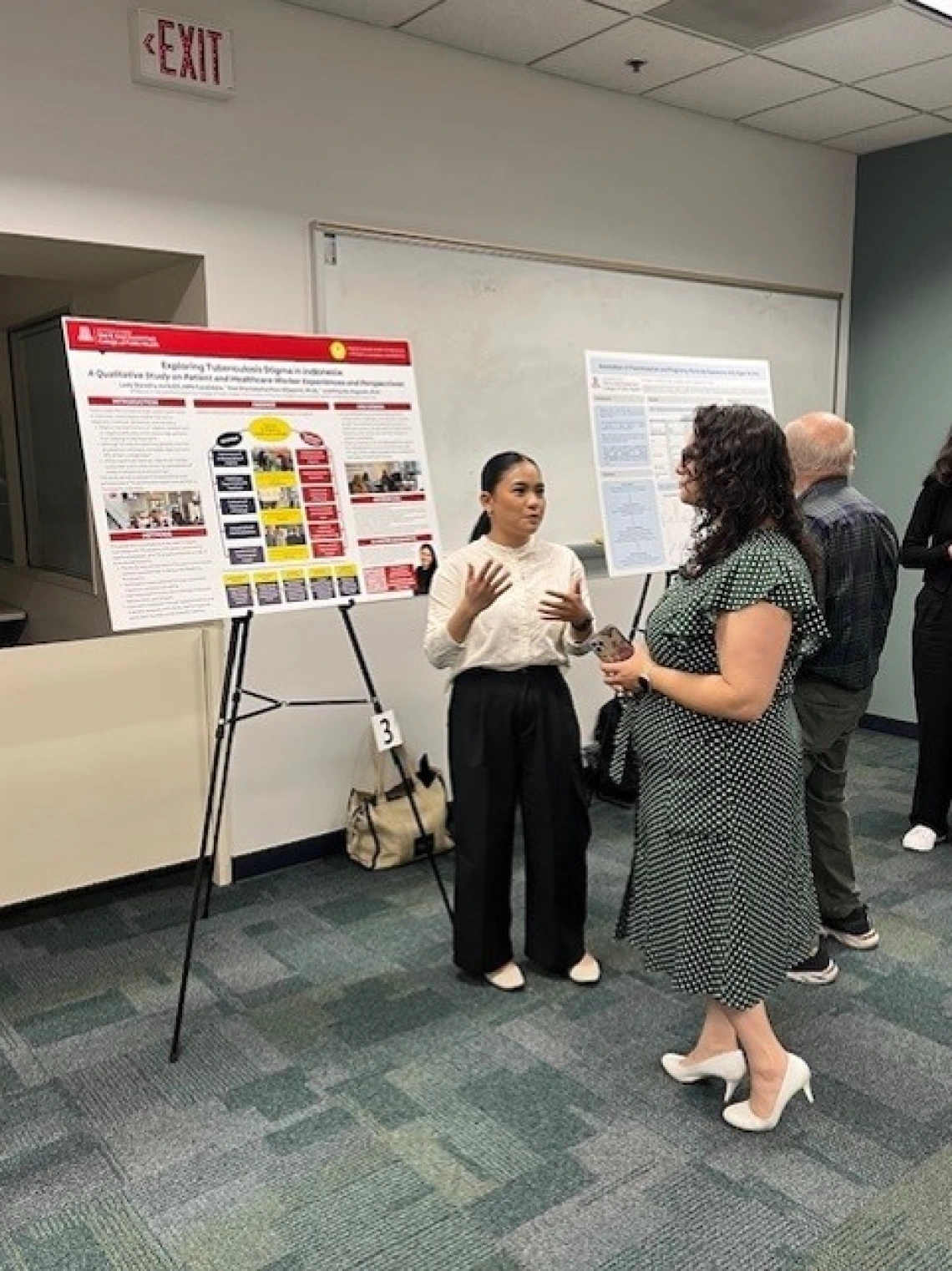Doctor explaining her project poster